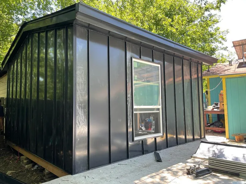 Black standing seam metal wall panels for Roof Inspection in Norwood